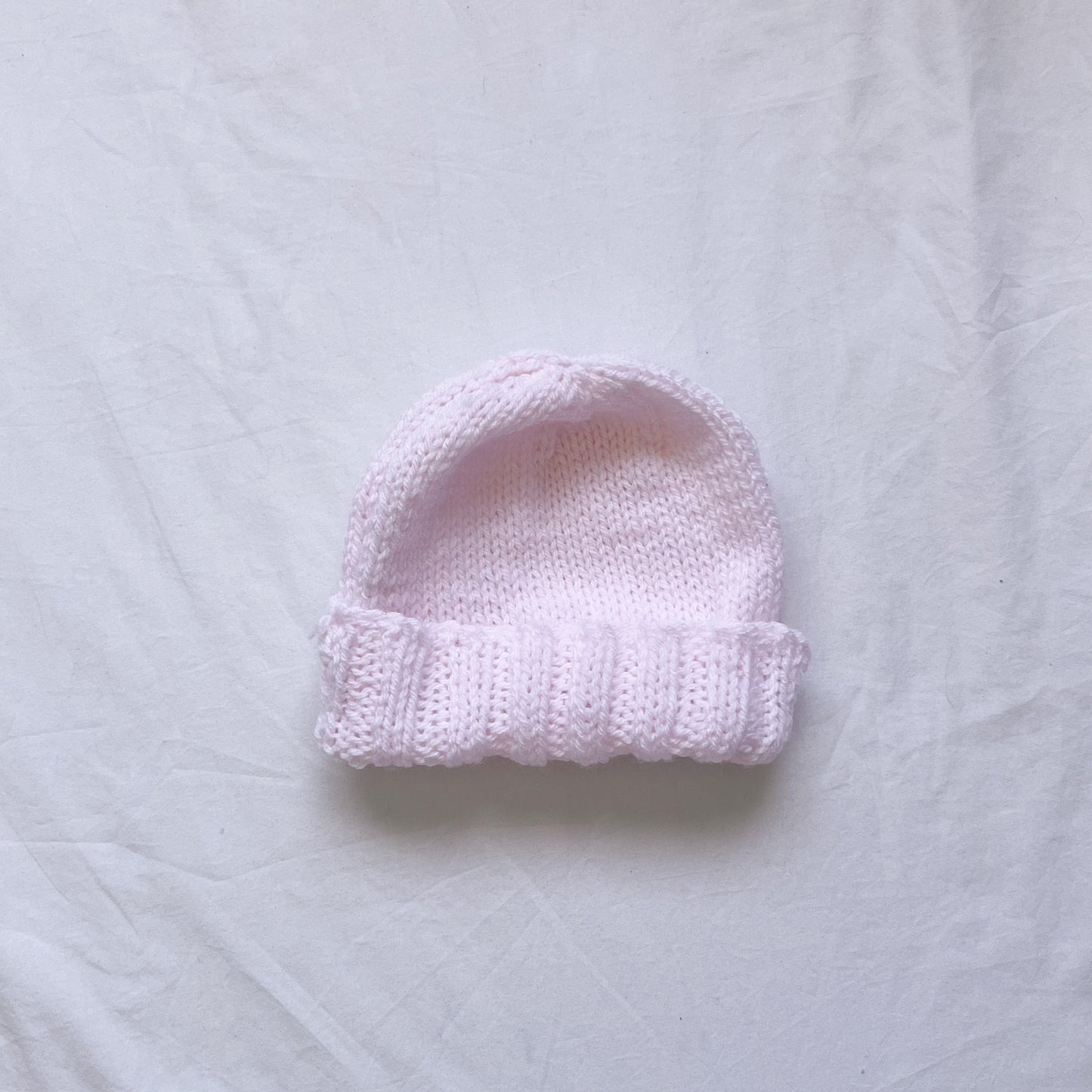 Hand knit pink beanie, aprox 6-12m