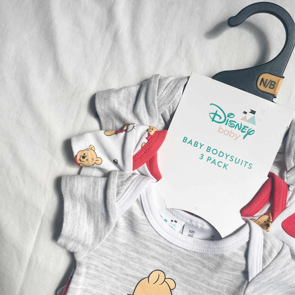 Pooh bear bodysuits, NB