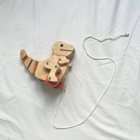 Wooden pull along dinosaur