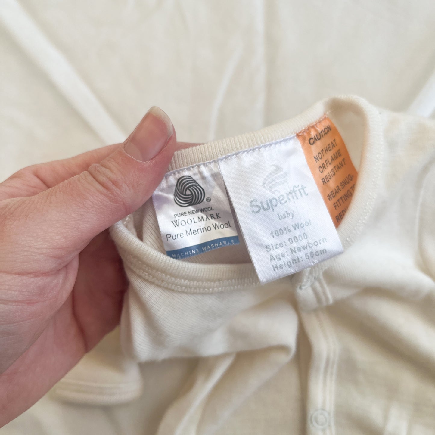 Superfit merino sleepsuit (faint mark), NB
