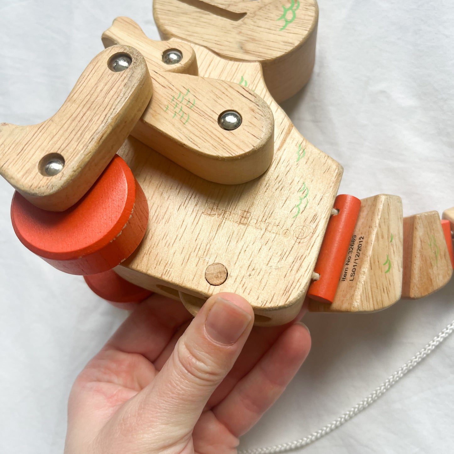Wooden pull along dinosaur