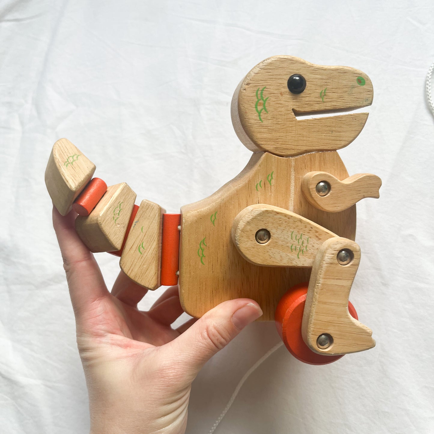 Wooden pull along dinosaur