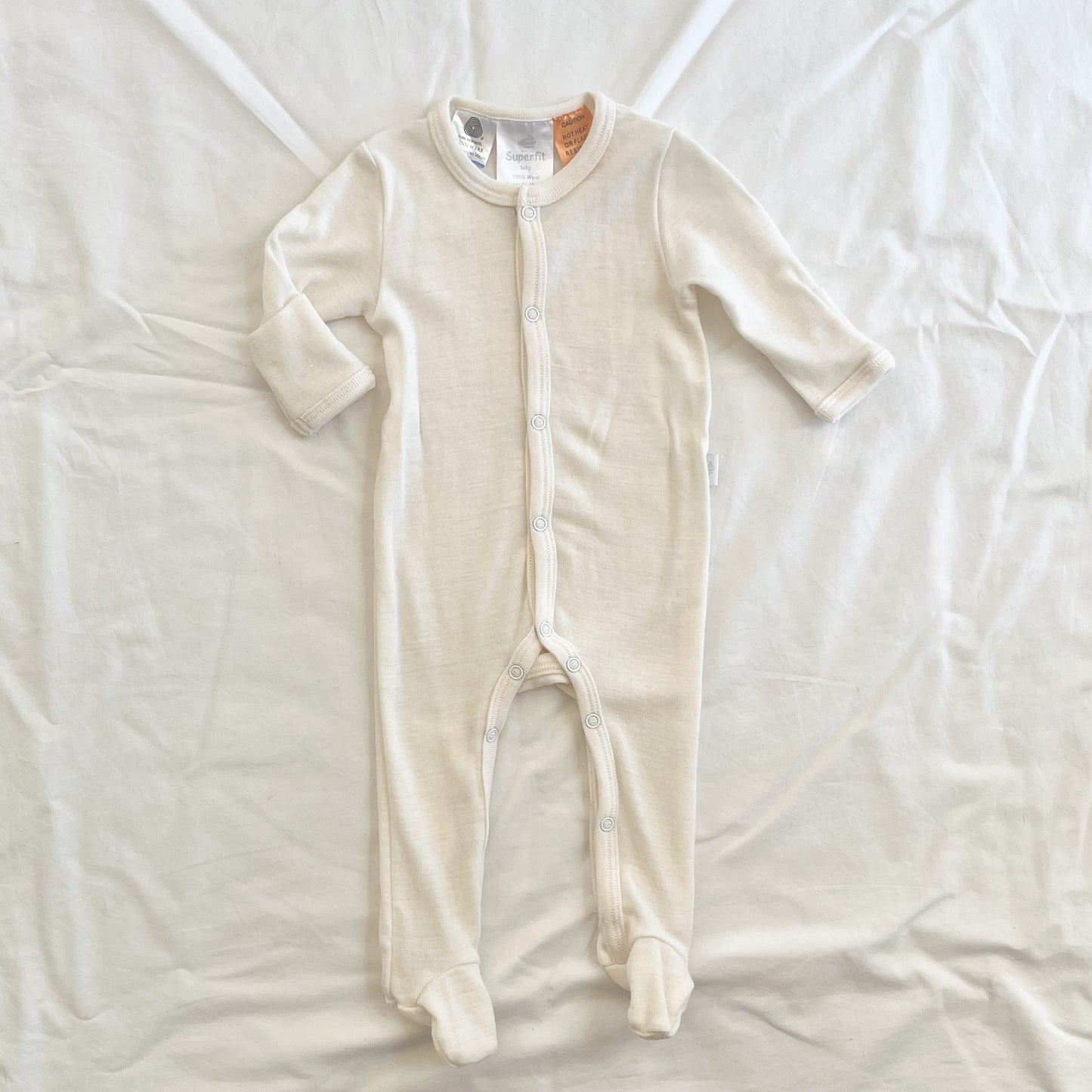 Superfit merino sleepsuit (faint mark), NB
